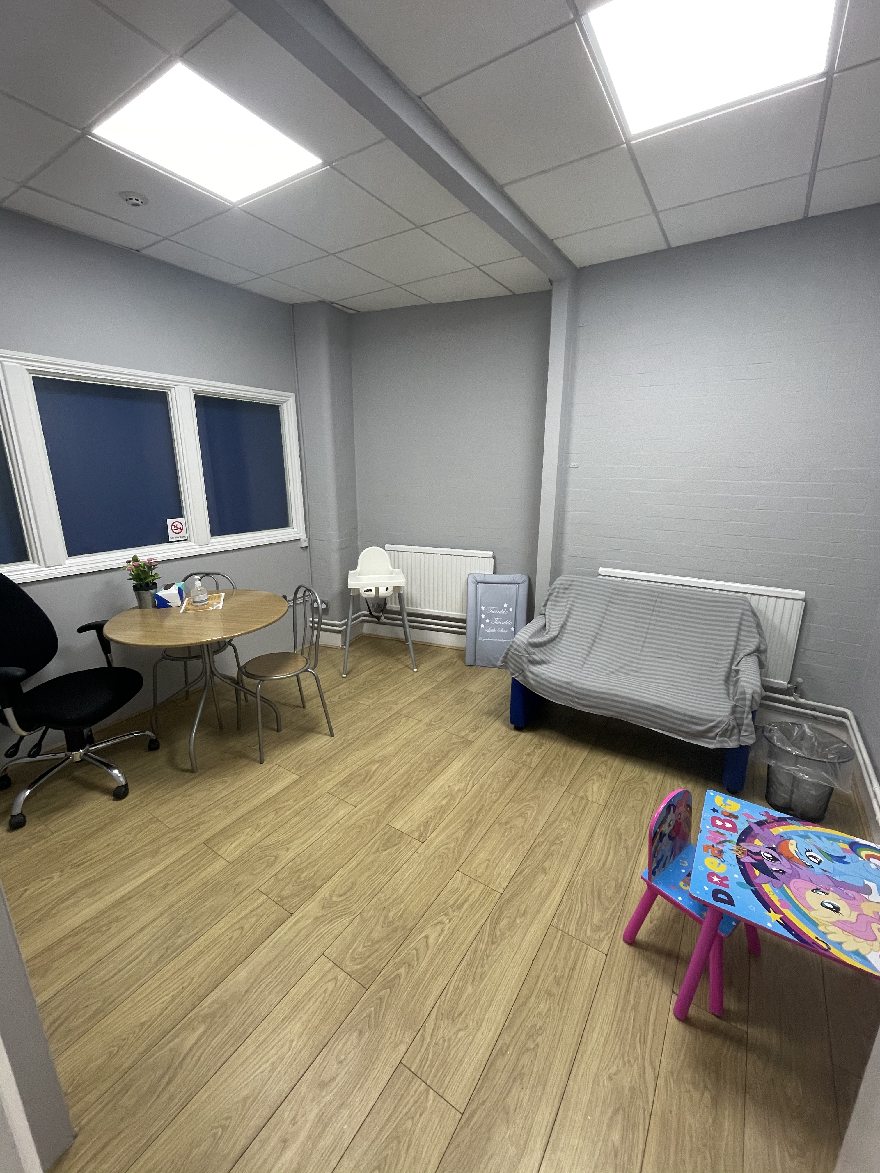 room with children's play toys, sofa and tv 
