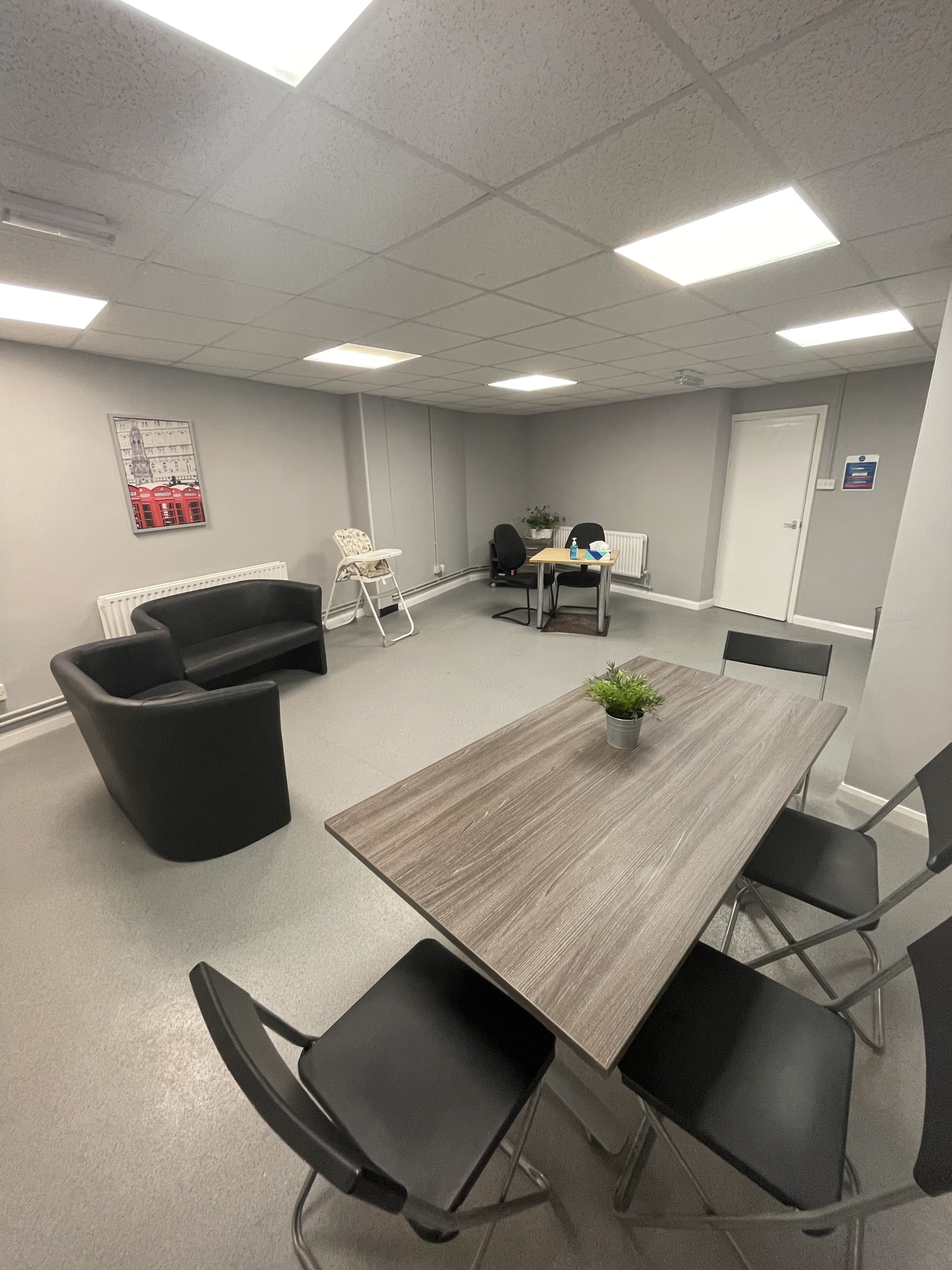 room with seats, table and chairs